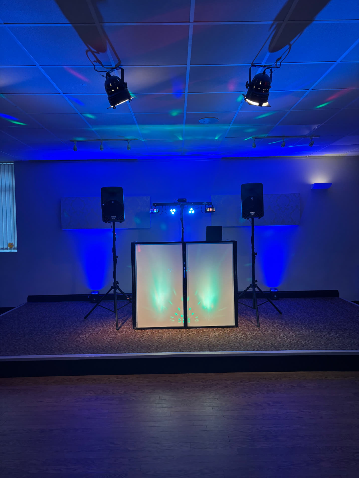 Full DJ stage setup with professional lighting